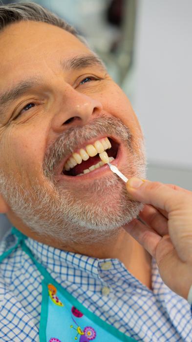 man getting new porcelain veneers in fort lauderdale